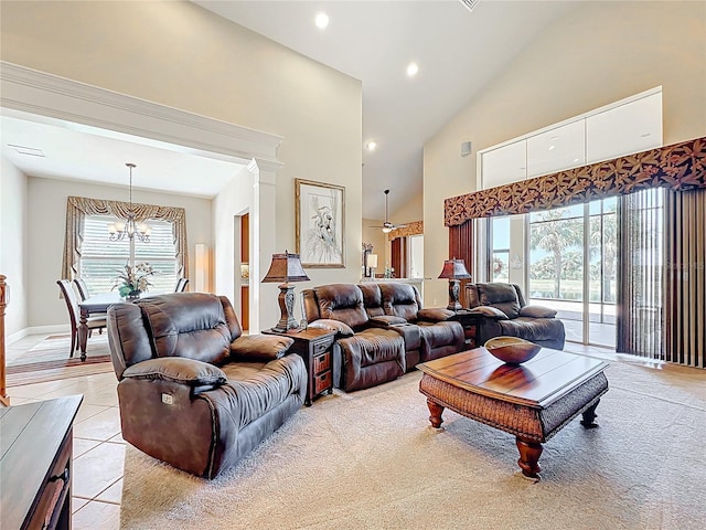 23901 Waverly Cir, Venice, FL 34293 - living room featuring high vaulted ceiling, a chandelier, light tile patterned floors, recessed lighting, and baseboards