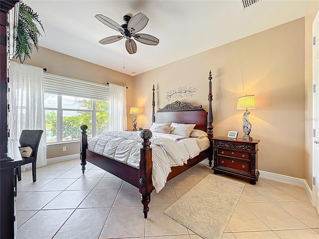 23901 Waverly Cir, Venice, FL 34293 - bedroom with baseboards, light tile patterned floors, and ceiling fan