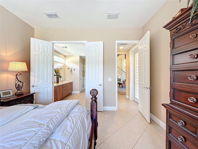 23901 Waverly Cir, Venice, FL 34293 - bedroom with light tile patterned flooring and baseboards