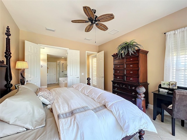 23901 Waverly Cir, Venice, FL 34293 - bedroom featuring light tile patterned floors, ceiling fan, baseboards, and ensuite bathroom