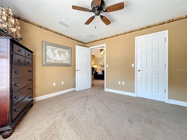 23901 Waverly Cir, Venice, FL 34293 - unfurnished bedroom featuring carpet floors, baseboards, and ceiling fan