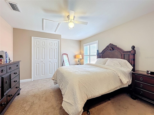 23901 Waverly Cir, Venice, FL 34293 - bedroom with light carpet, a closet, a ceiling fan, and baseboards