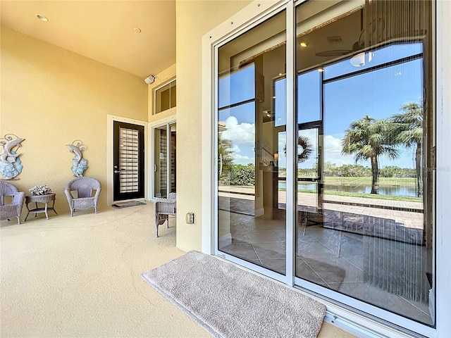 23901 Waverly Cir, Venice, FL 34293 - doorway to property featuring a water view and stucco siding