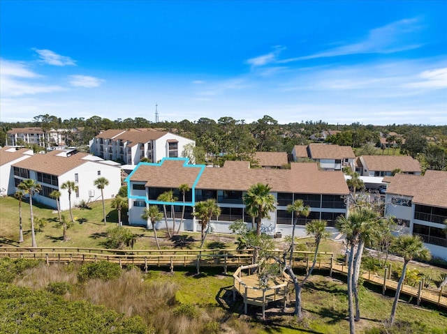 990 Bird Bay Way Unit 258, Venice, FL 34285 - back of house featuring a residential view and roof with shingles