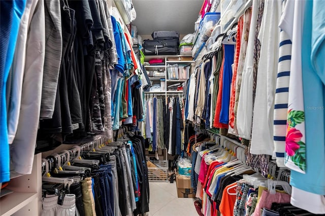 walk in closet featuring tile patterned flooring