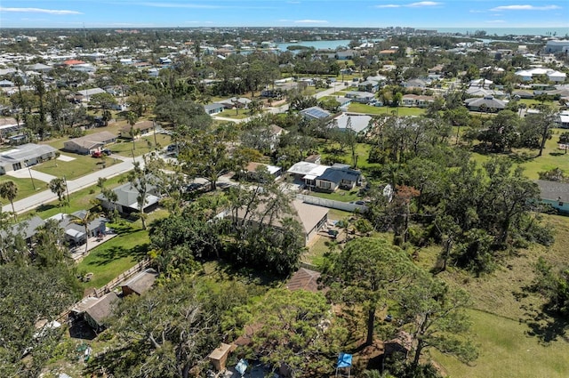 drone / aerial view with a residential view and a water view