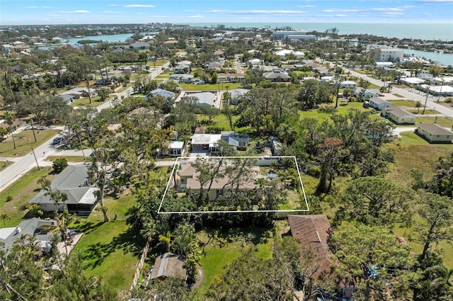 drone / aerial view with a residential view and a water view