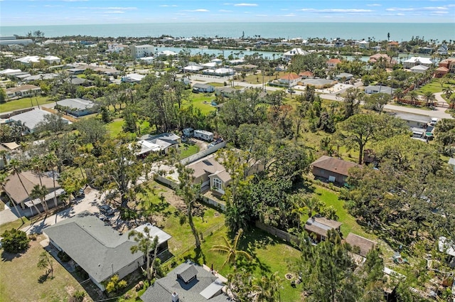 drone / aerial view featuring a residential view and a water view