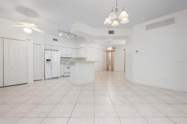 kitchen featuring white appliances, ceiling fan with notable chandelier, visible vents, and light countertops