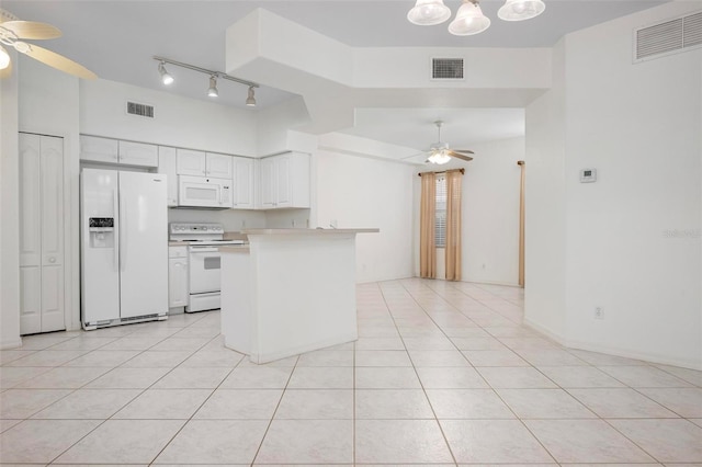 kitchen featuring white appliances, a ceiling fan, and visible vents