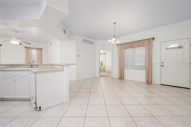 kitchen with visible vents, ceiling fan with notable chandelier, white cabinets, and light countertops