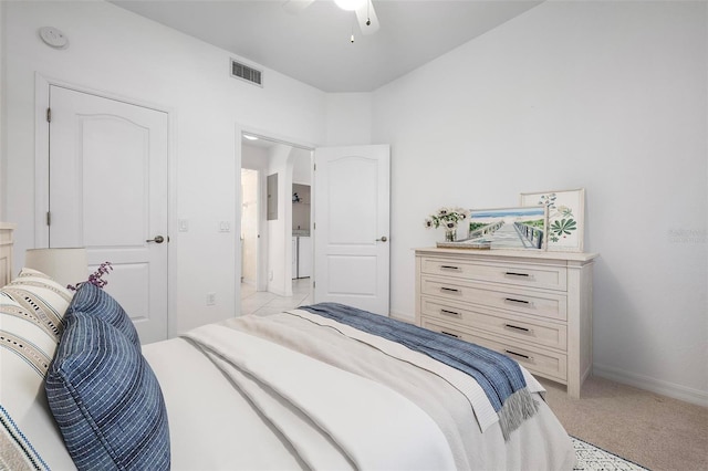 bedroom featuring ceiling fan, baseboards, visible vents, and light carpet