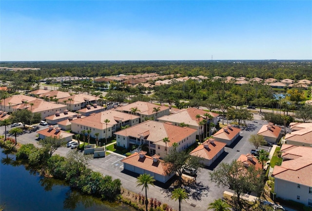 aerial view with a residential view and a water view