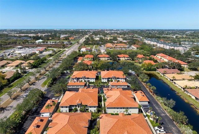 birds eye view of property featuring a residential view and a water view