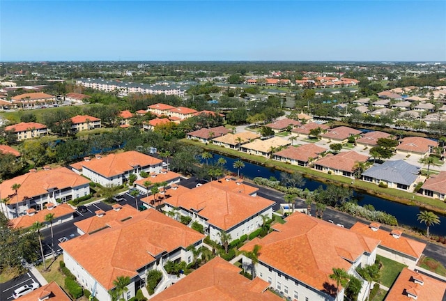 aerial view with a residential view and a water view