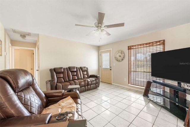 living room with light tile patterned floors, baseboards, and a ceiling fan