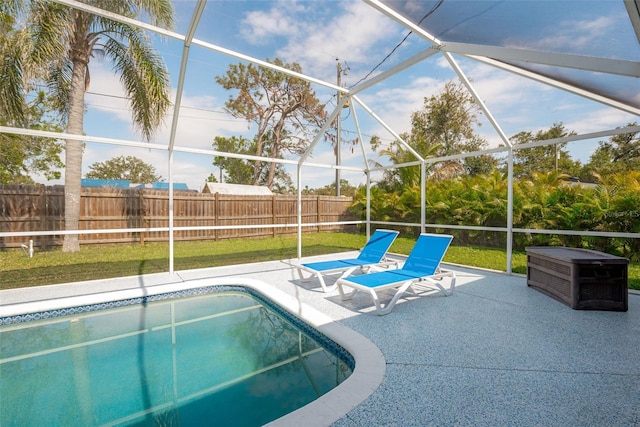 view of swimming pool featuring a lanai, a patio area, a fenced in pool, and a fenced backyard