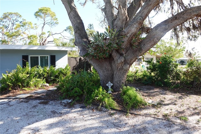 view of side of home with fence