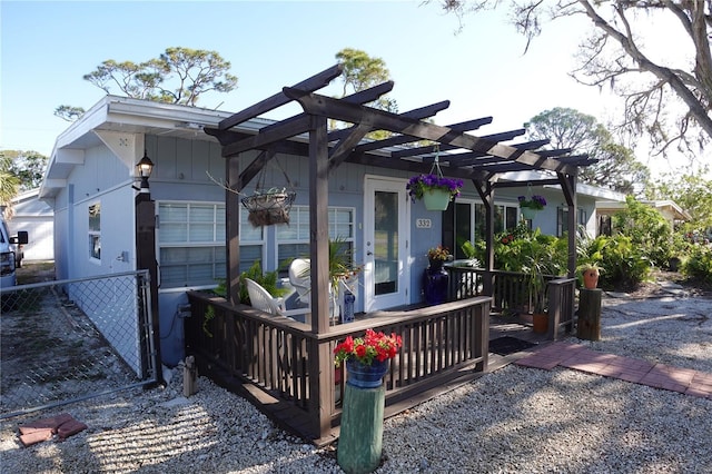 exterior space featuring fence and a pergola