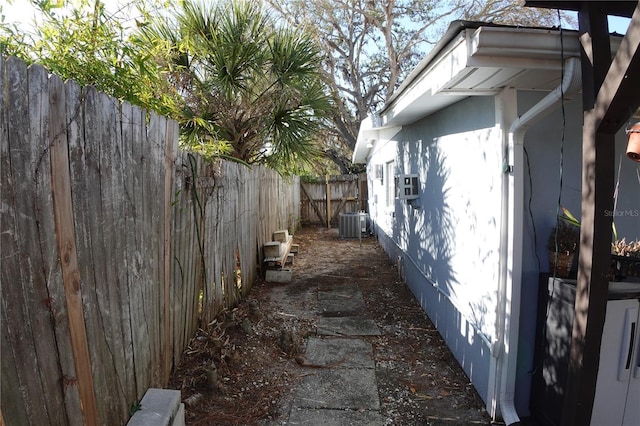 view of side of home featuring a fenced backyard