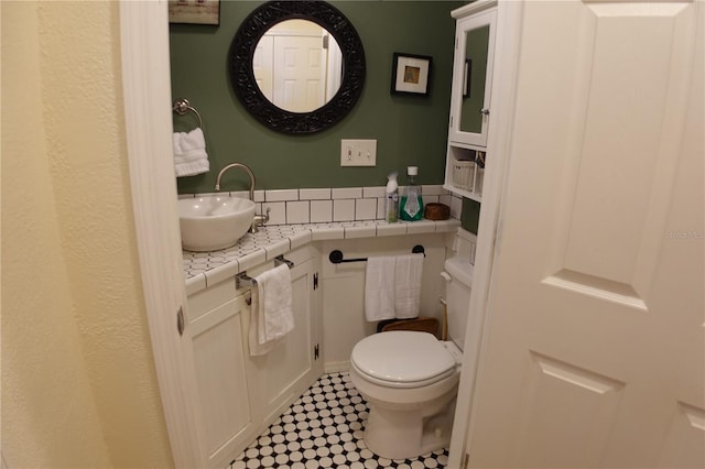 bathroom with toilet and vanity