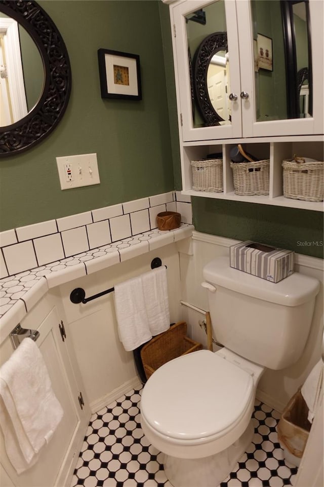 bathroom featuring tile patterned floors and toilet