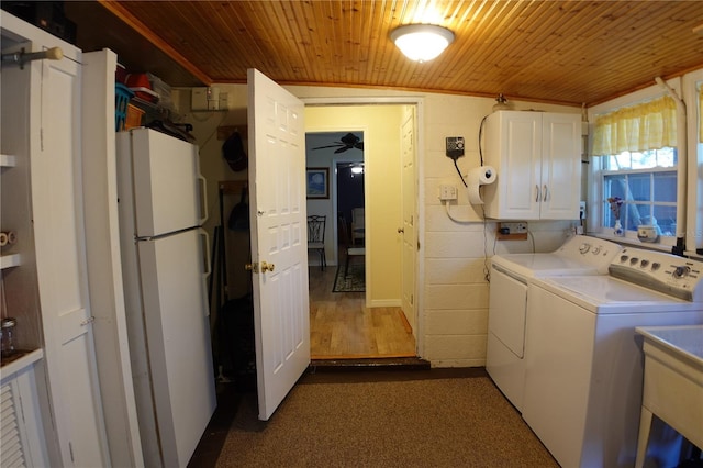 laundry area with cabinet space, wood ceiling, ceiling fan, and separate washer and dryer