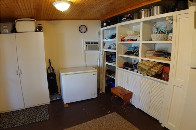 clothes washing area with wooden ceiling and an AC wall unit