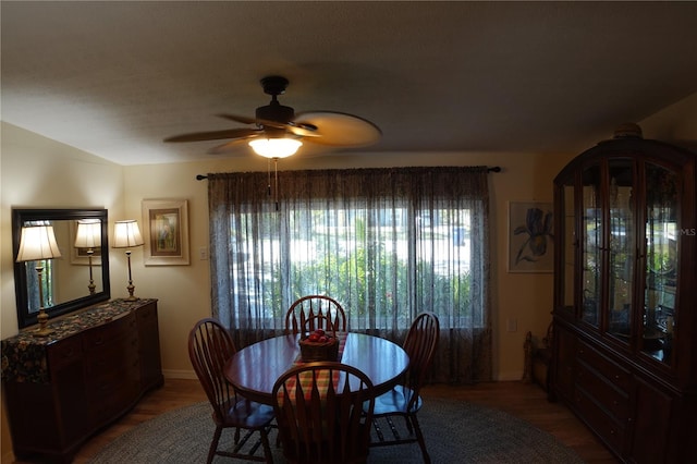 dining area featuring wood finished floors and a ceiling fan