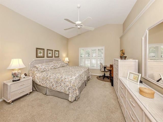 bedroom featuring lofted ceiling, multiple windows, a ceiling fan, and light colored carpet