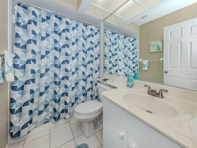 bathroom featuring visible vents, toilet, vanity, a shower with curtain, and tile patterned flooring
