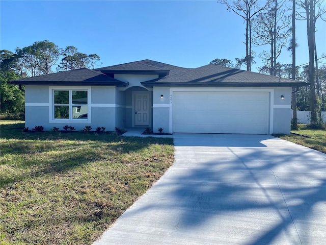 4595 Horseshoe Ave, North Port, FL 34286 - view of front of home featuring roof with shingles, stucco siding, concrete driveway, a front lawn, and a garage