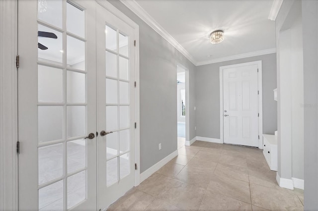 entrance foyer featuring light tile patterned floors, french doors, baseboards, and crown molding