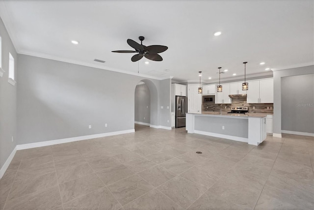 unfurnished living room featuring arched walkways, baseboards, a ceiling fan, and ornamental molding