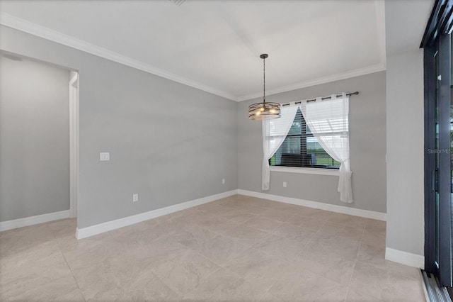 empty room with crown molding and baseboards