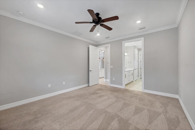 unfurnished bedroom with light colored carpet, baseboards, and ornamental molding