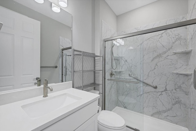 bathroom featuring vanity, toilet, and a marble finish shower