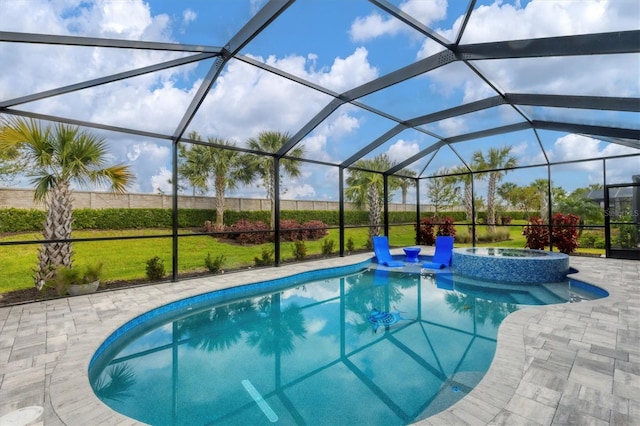 view of pool featuring a patio, a lawn, a pool with connected hot tub, and a lanai