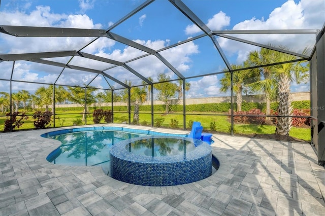 view of pool with a patio, a lanai, and a pool with connected hot tub