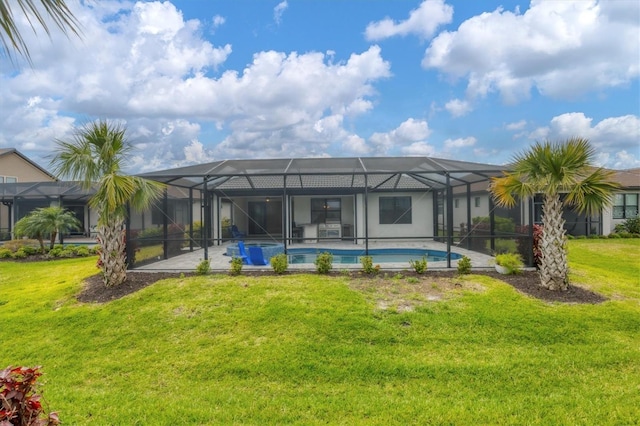 back of house featuring a lanai, a patio area, an outdoor pool, and a yard