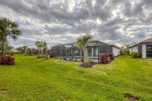 view of yard with a lanai and an outdoor pool