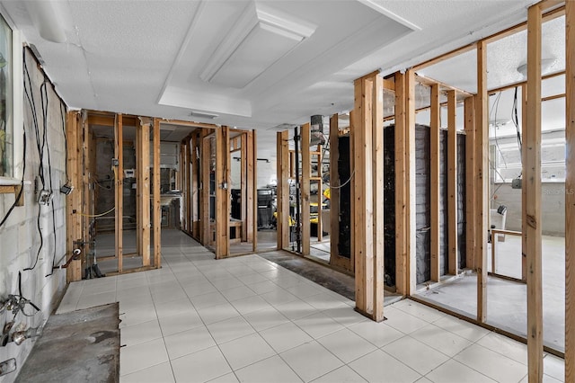 interior space with a tray ceiling and visible vents