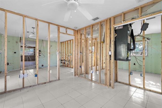 interior space featuring visible vents, ceiling fan, and tile patterned flooring