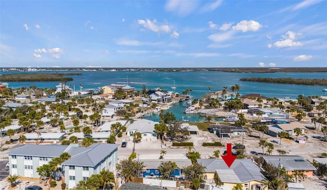 birds eye view of property with a residential view and a water view