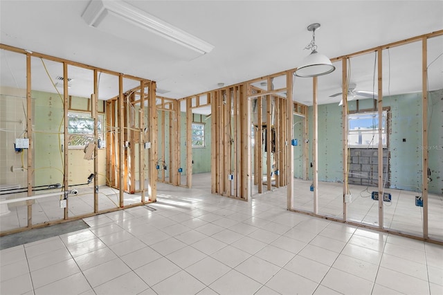 bathroom with tile patterned floors, visible vents, and a ceiling fan