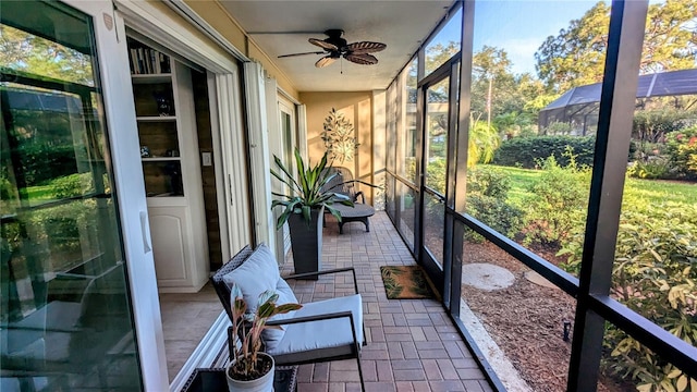 sunroom / solarium with ceiling fan