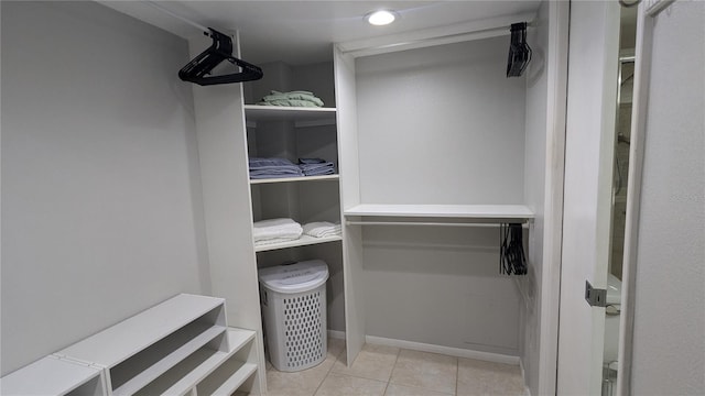 spacious closet featuring tile patterned flooring