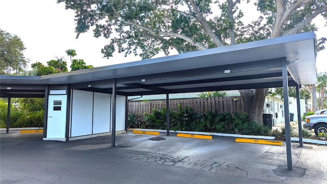 covered parking lot with fence