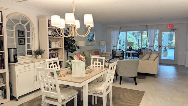 dining space featuring a chandelier and crown molding