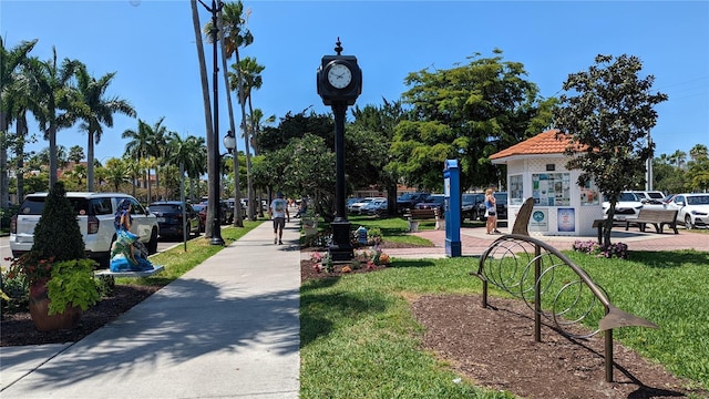 view of home's community featuring a lawn